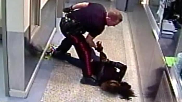 A police officer having tackled 