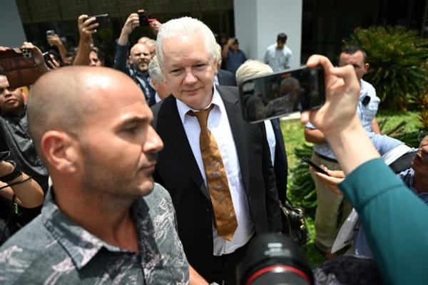 Julian Assange, now free, returns to his native Australia