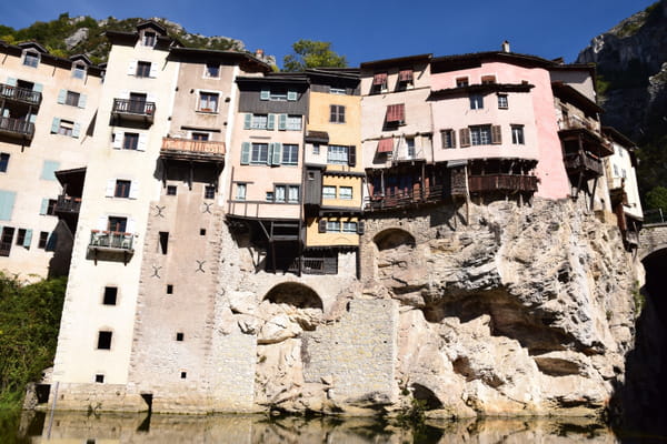 With its colorful houses above the void, this medieval village is one of the most original in France