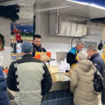 At the Nîmes market halls, customers and stallholders extend the festivities to their plates on this Christmas Day